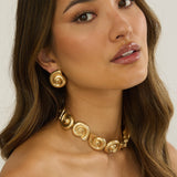 Noxelle Spiral Shell Earrings Gold